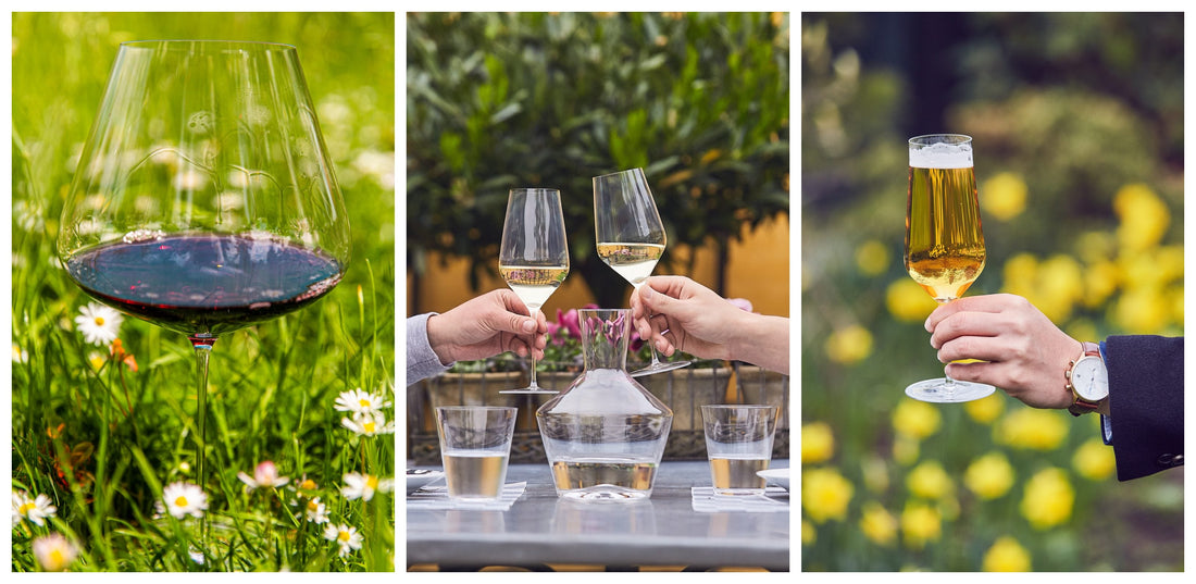 Zalto white wine glasses raised in a toast outdoors